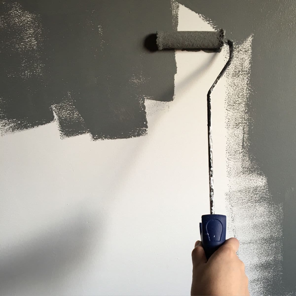 Paint roller covering a wall